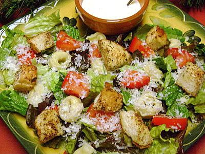 /></span></span><br/> <br/> TORTELLINI CAESAR SALAD<br/> (Source: slightly adapted from Quick Cooking)<br/> <br/> 1 (9-14 oz.) pkg. frozen cheese tortellini (I always use frozen cheese tortellini)<br/> 1/2 c. mayonnaise (I use low fat mayonnaise)<br/> 1/4 c. milk (I use low fat or fat free milk)<br/> 1/4 c. freshly grated Parmesan cheese (or you can use the shredded Parmesan in the bag found in the dairy case-don't use the one in the can though-it's way too dry and salty)<br/> 2 Tbsp. lemon juice<br/> 1-2 cloves garlic, finely minced<br/> Freshly ground black pepper to taste<br/> 8 c. torn Romaine lettuce*<br/> 1/3 c. freshly grated Parmesan cheese**<br/> 1 c. seasoned croutons<br/> Halved grape or cherry tomatoes (optional-I use regular cut-up tomatoes when I don't have grape or cherry tomatoes-like in the salad in the picture)<br/> <br/> Cook tortellini according to package directions; drain and rinse with cold water.<br/> <br/> For dressing, in a small bowl, whisk together mayonnaise, milk, 1/4 c. Parmesan, lemon juice, garlic and pepper.<br/> <br/> Place tortellini in a large salad bowl. Add Romaine lettuce and 1/3 c. Parmesan cheese.<br/> <br/> Just before serving, drizzle with dressing and toss to coat. Top with croutons and tomatoes, if desired. 10 servings.<br/> <br/> *You can mix different kinds of lettuce if you choose. I usually serve the dressing on the side when we have it here at home so that we can enjoy the salad for a few days without it getting soggy.<br/> <br/> **I sprinkle on the cheese as I serve it....I find it easier to control that way.<br/> <br/> NOTE: Add some cooked sliced or cubed chicken to this and you've got yourself a main dish salad...great during the summer on those I don't want to heat up the kitchen nights.<br/> <br/> <span style=